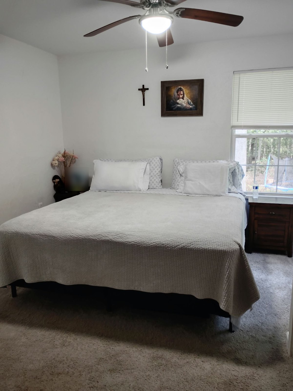 The same bed made and the room tidied after cleaning